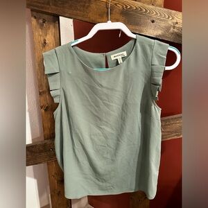 Light green colored blouse. Size medium